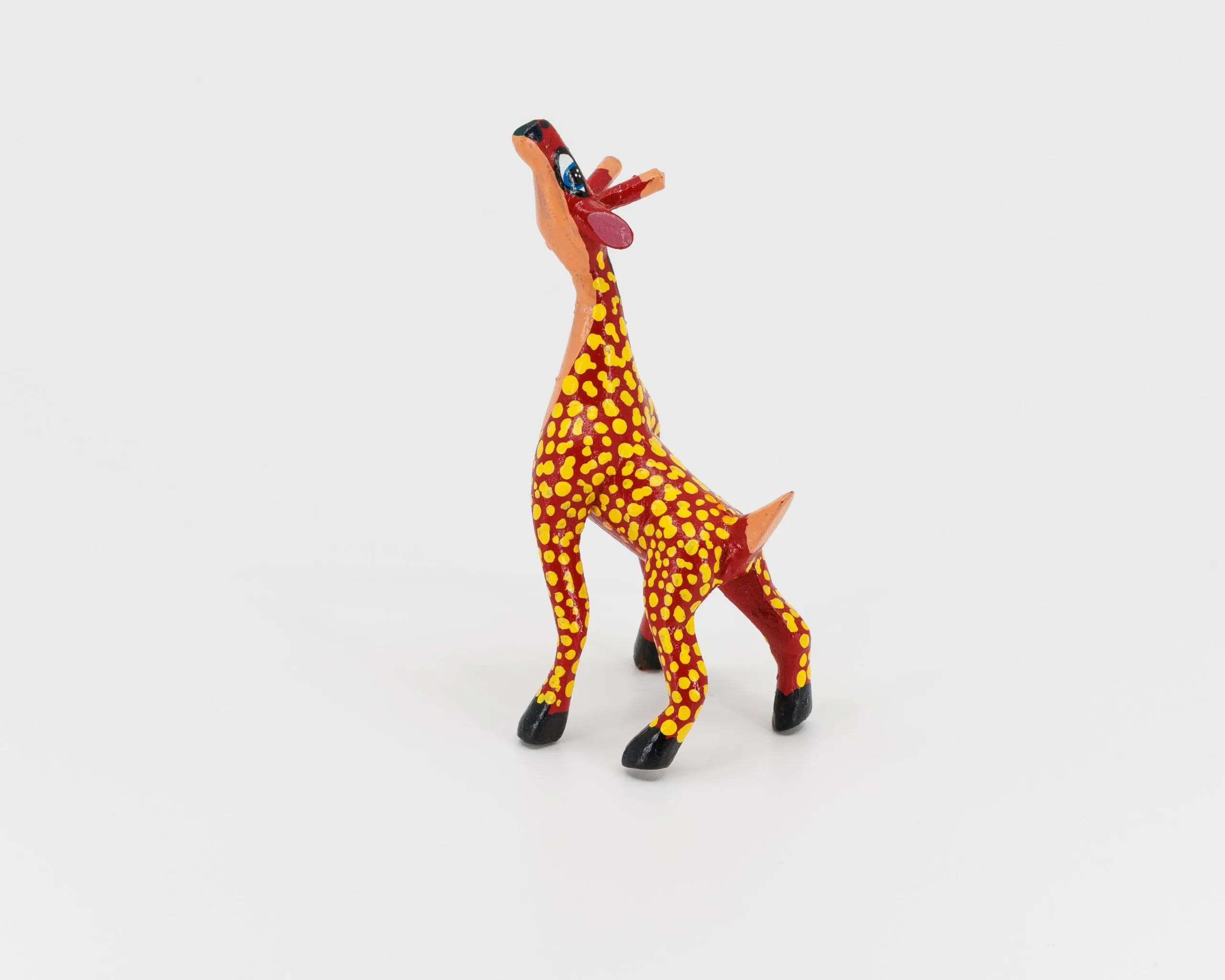 alebrije-girafe rouge à point jaunes